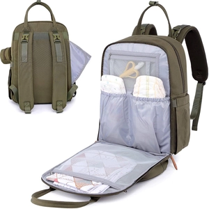 Detail of army green diaper bag interior with changing mat and mesh storage pockets