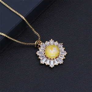 Detailed view of sunflower pendant with yellow center stone and cubic zirconia inlay