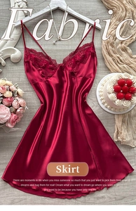 Detail of burgundy satin sleepwear with lace neckline and silky fabric texture