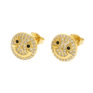 Detailed view of 18K gold smile earrings featuring white zircon pavé and black eyes