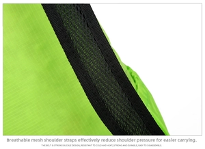 Detail of green foldable backpack showing breathable mesh strap and ripstop nylon fabric