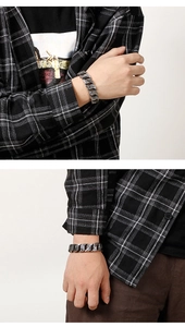 Macro shot of men's stainless steel Cuban bracelet with vintage engraved patterns