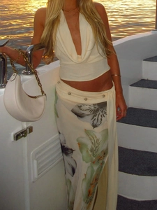 Floral print maxi skirt set with halter top on yacht deck for summer vacation