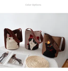 Detailed view of three cartoon cat bucket bags with plaid and polka dot straps