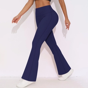 Detail of high-waist yoga leggings showing dark blue fabric and flared leg design