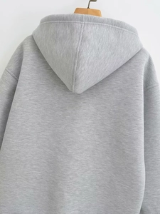 Detailed back view of grey oversized hooded sweatshirt showing dropped shoulder seam and texture