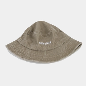 Detail of New York embroidery and metal eyelets on vintage washed cotton bucket hat