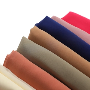 Detail of chiffon scarves showing multiple colors and the soft textured fabric grain