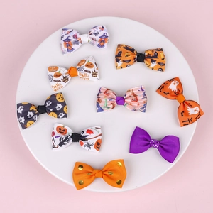 Set of 9 Halloween bow hair clips with pumpkin, ghost, and bat prints on ribbon