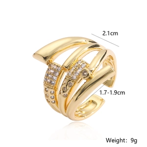 Detail showing dimensions of gold-plated multi-layer open ring with zircons on white background