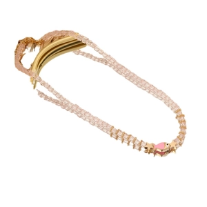 Bohemian layered pink crystal beaded bracelet with fish and gold star charms on white background