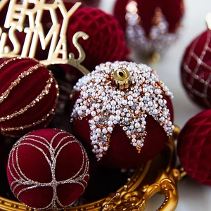 Luxurious velvet burgundy Christmas balls with white bead embroidery and gold glitter details