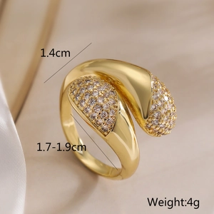 Macro shot of 1.4cm wide irregular gold ring with pave cubic zirconia and polished finish
