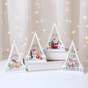 Christmas LED triangle lanterns with Santa and reindeer motifs for festive tabletop decor