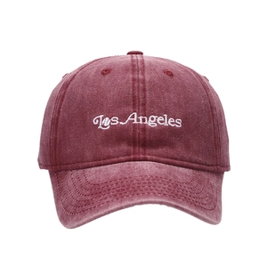 Vintage burgundy baseball cap with white Los Angeles embroidery on washed cotton fabric
