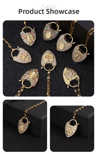Macro shot of 18K gold-plated heart and lock pendants with zircon and micro-inlays