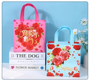 Pink and blue Mother's Day gift bags with roses and Happy Mother's Day gold text