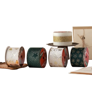 Dark green and cream Christmas ribbons with gold foil deer and snowflake patterns