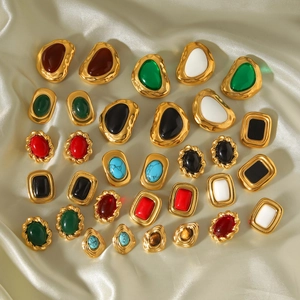 French vintage gold clip earrings with colorful oval and square gemstones on silk