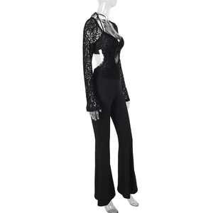 Detail view of black lace long sleeves and open back cutout on a slim fit jumpsuit