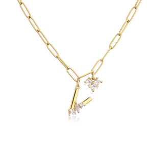 Detail of gold paperclip chain necklace with zircon V letter and heart charms