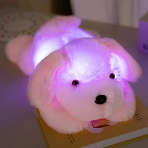 Luminous pink plush toy dog with colorful LED lights in a soft lying position for kids