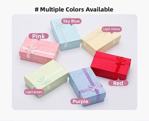 Multiple colorful jewelry gift boxes with ribbon bows for rings and necklaces