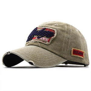 Vintage washed khaki baseball cap with 3D embroidery and distressed ripped brim detail