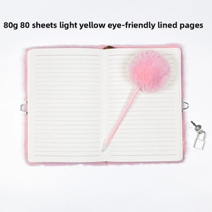 Detail of A5 pink plush notebook set with pom-pom pen and 80gsm lined eye-care paper