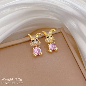 Detail view of gold rabbit stud earrings with pink crystal and sizing specifications