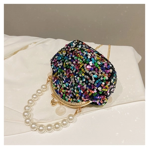 Detail of glitter sequins mini shell bag with kiss lock and elegant faux pearl handle