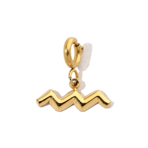 Close-up of a golden wavy geometric charm pendant made of high-quality stainless steel