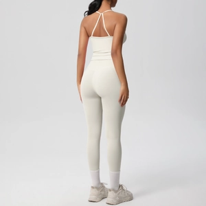 Rear view of cream yoga set featuring cross-back sports bra and high-waisted leggings