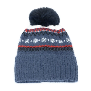 Detail of blue winter knit hat with pom-pom and Nordic snowflake pattern design
