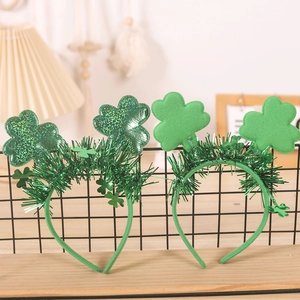 Close-up of Saint Patrick's Day headbands with green sequins and tinsel decorations