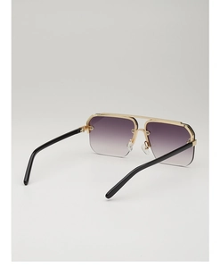 Detail view of square metal browline sunglasses with gradient purple lenses and gold frame