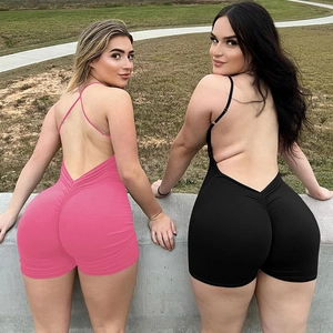 Close-up showing the sexy backless design and ruched details of the pink and black rompers