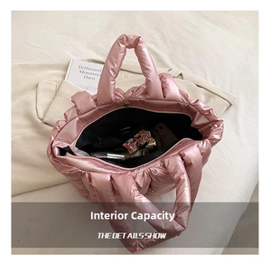 Top view of pink quilted tote bag interior showing capacity for cosmetics and wallet