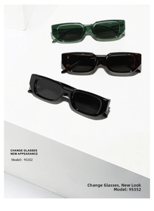 Close-up of three retro rectangle sunglasses in black, tortoise, and green on white podium