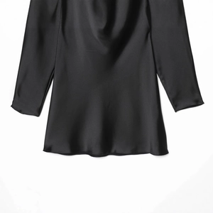 Elegant black long sleeve satin dress with cowl neck drape and glossy silky texture