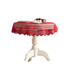 Festive red lace round tablecloth with intricate patterns for Christmas home decor