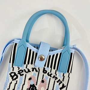 Striped knit crossbody phone bag with light blue soft handle and cartoon bunny design