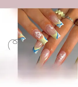 Macro detail of long coffin press-on nails with blue yellow waves and white floral patterns