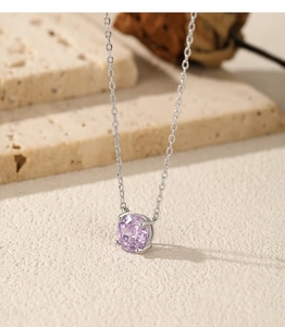 Macro shot of S925 silver necklace with faceted lavender rose cut purple gemstone