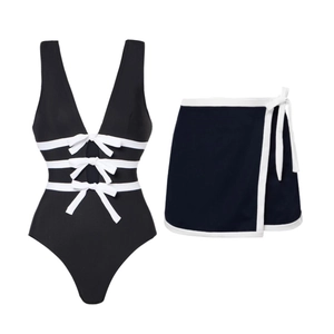 Women's V-neck swimsuit set with black cutout one-piece, white bows, and wrap skirt