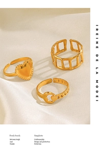 Detail of 18K gold-plated rings set featuring heart, hollow mesh and crescent moon designs