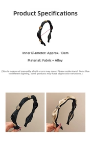 Detail of camellia headbands in black and beige with 13cm inner diameter measurement