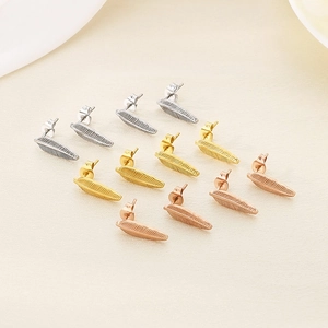 Set of twelve feather-shaped stud earrings in silver, gold and rose gold tones