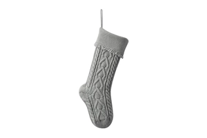 Close-up of gray knit Christmas stocking with thick cable weave and ribbed cuff detail