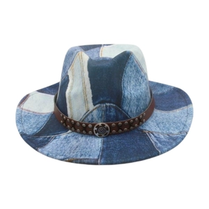 Detail view of western cowboy hat featuring denim print fabric and studded leather band